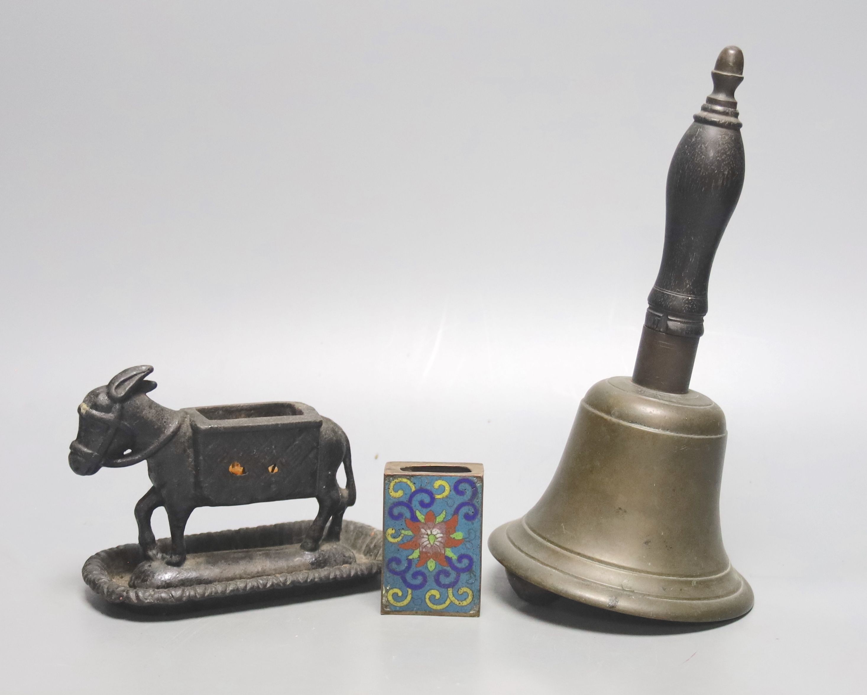 A brass handbell, iron donkey matchbox holder plus cloisonné matchbox cover. Bell, 23cms high.